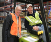 A forklift operator takes time to chat (and pose) with Senator Johnson