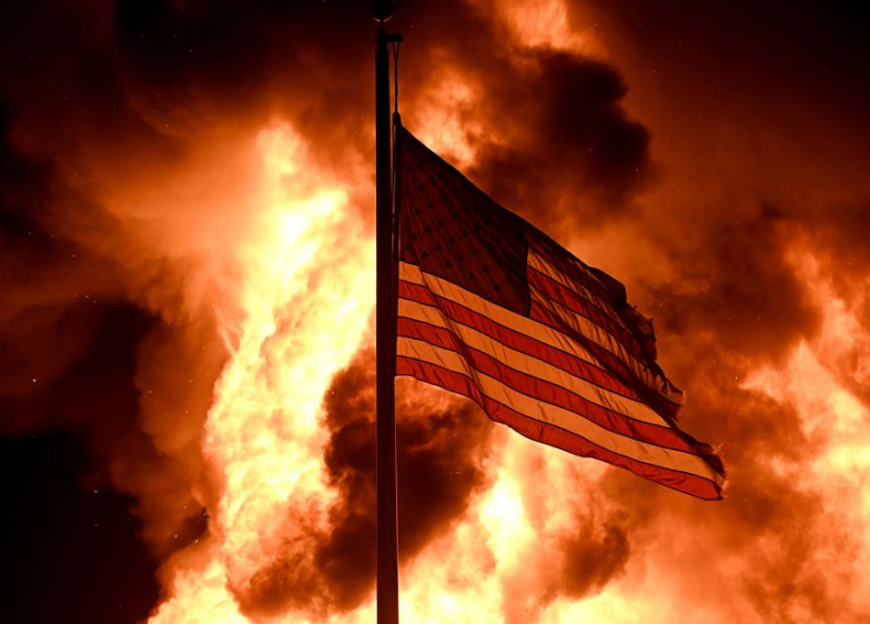 Flag with Kenosha Firing Burning Behind it